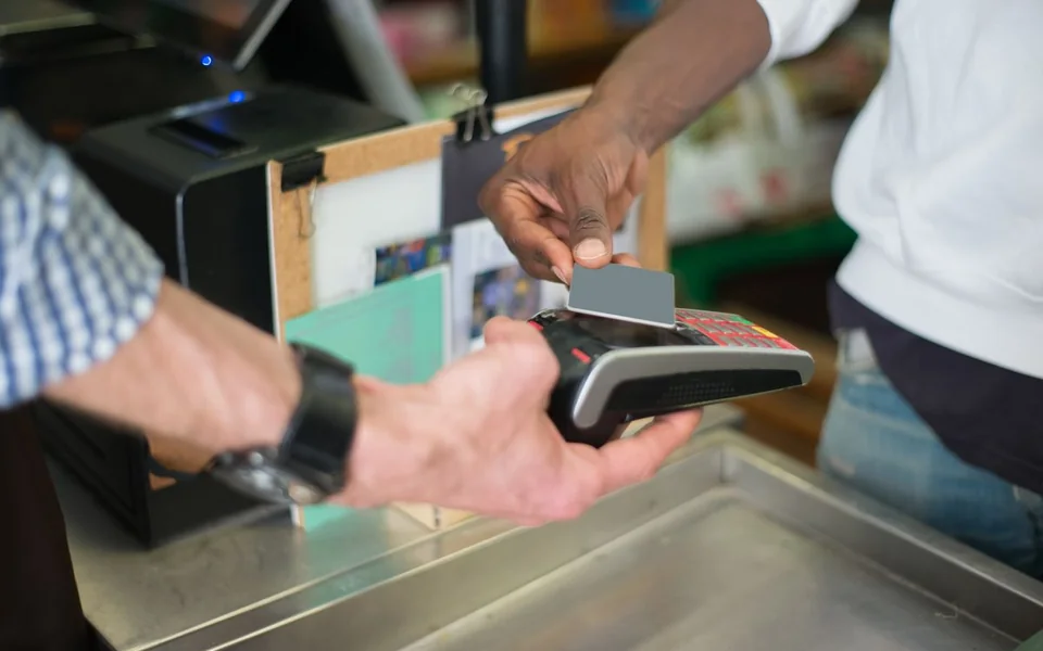 Customer tapping a card to complete a payment